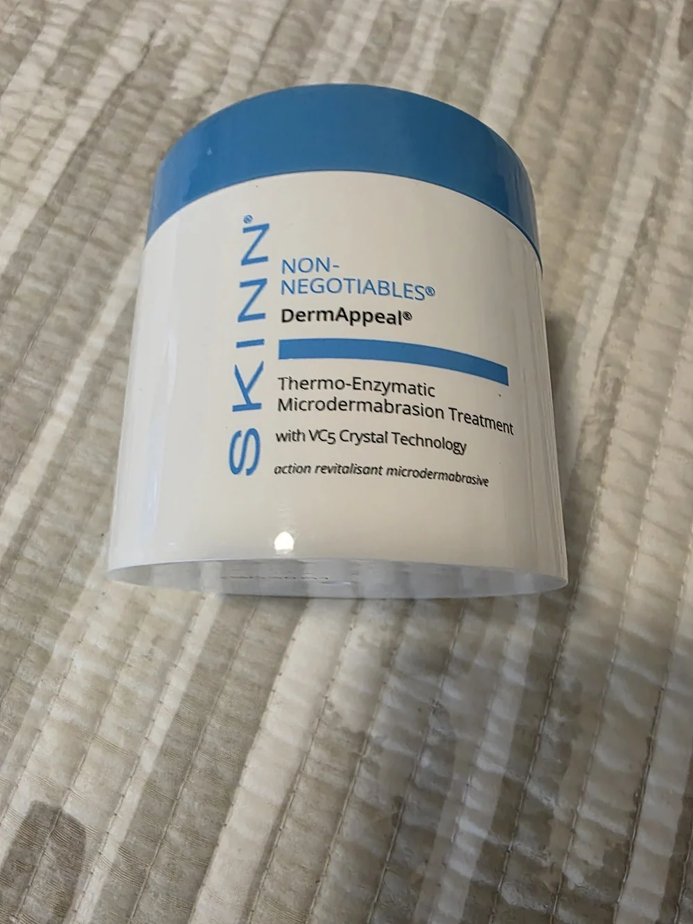 SKINN White Jar with Blue Lid Exfoliating Cream